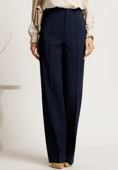 Pantaloni bleumarin din stofa evazati cu dunga imagine