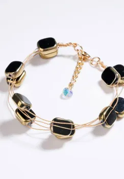 Bratara delicata cu elemente negre si metalice pe fire fine aurii imagine